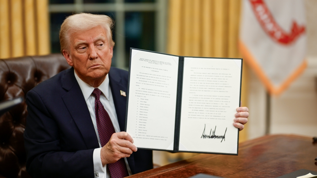 President Trump with an Executive Order. (White House on X)
